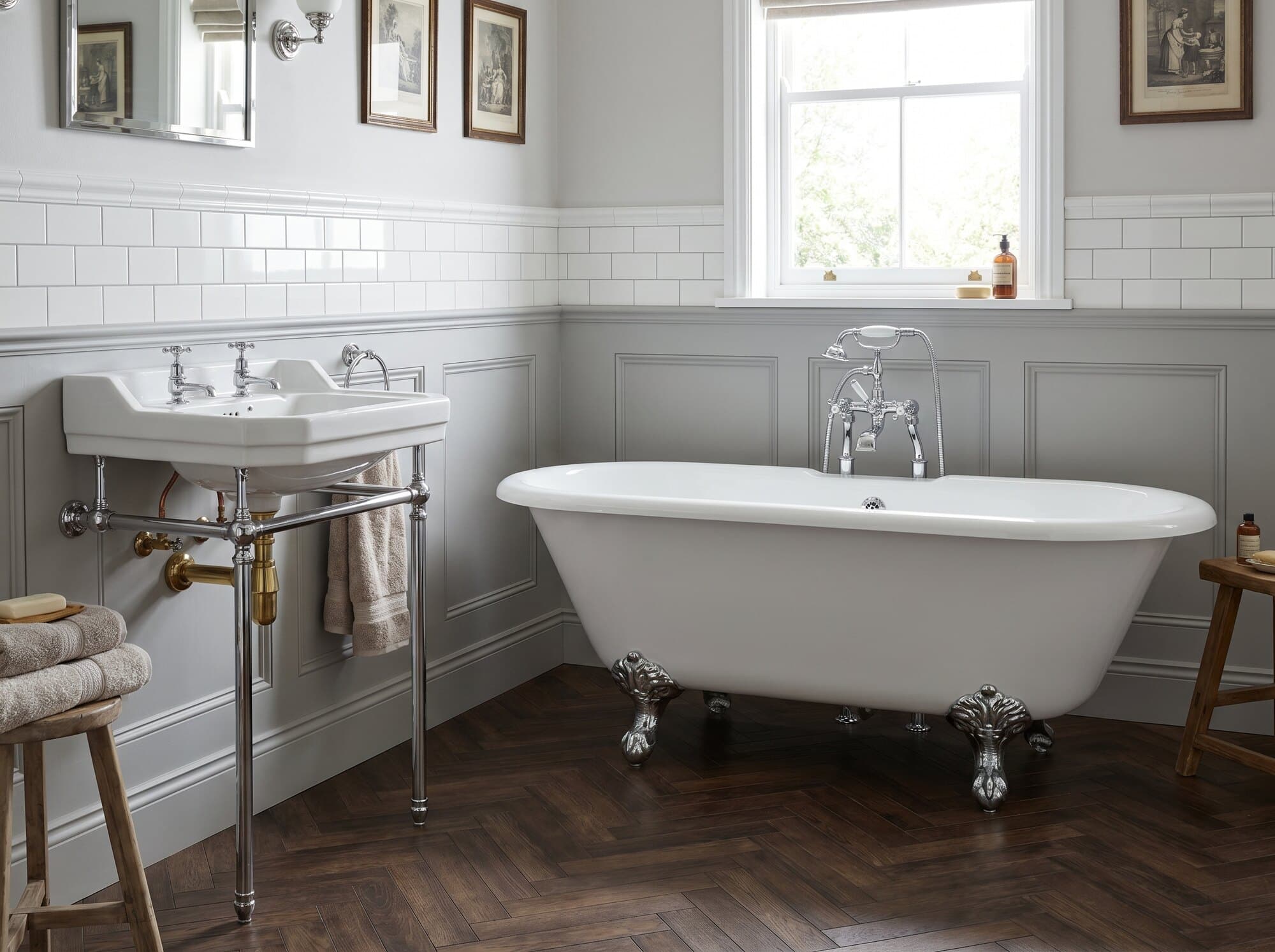 An illustrative classic family bathroom with metro tiles, a panelled bath and polished chrome.